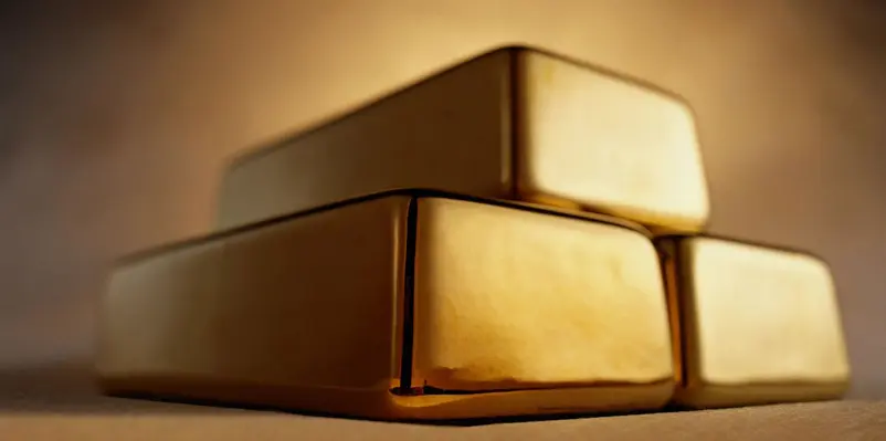 A close up of two gold boxes on top of each other.